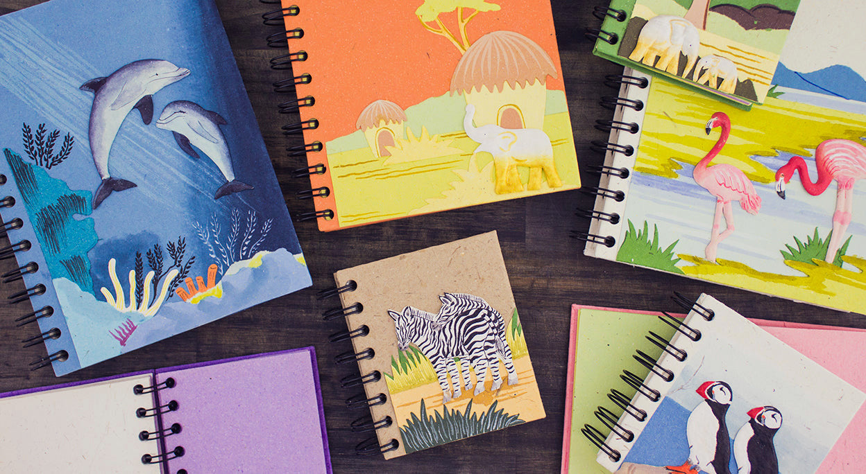 A journal notebook with an elephant and a tree